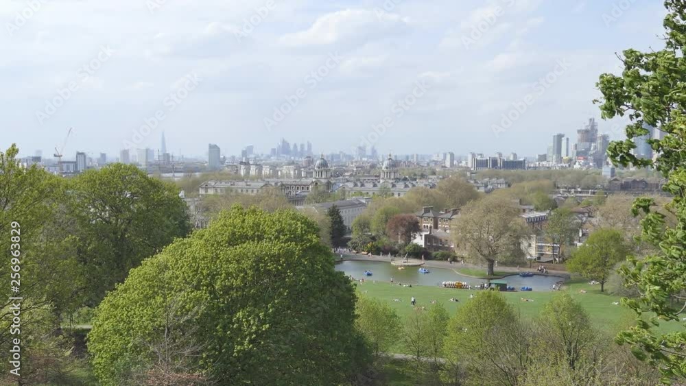 An overlook of a leafy park and central London in the distance. An overlook of a leafy park and central London in the distance.