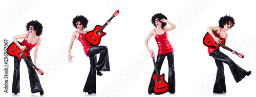Woman in afro wig playing guitar