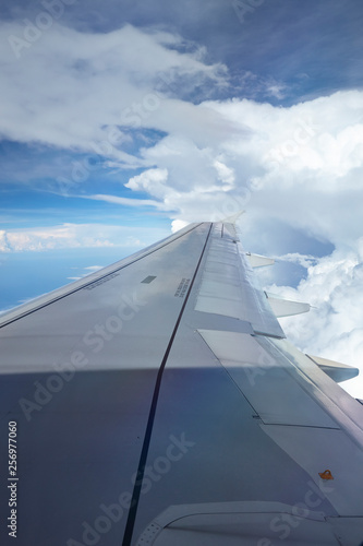 Window view of plane on wingside through storm