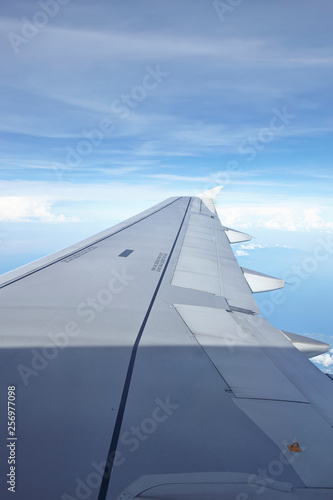Window view of plane on wingside through storm