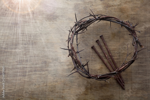 Jesus Crown Thorns and nails on Old and Grunge Wood Background. Vintage Retro Style. Free space for text