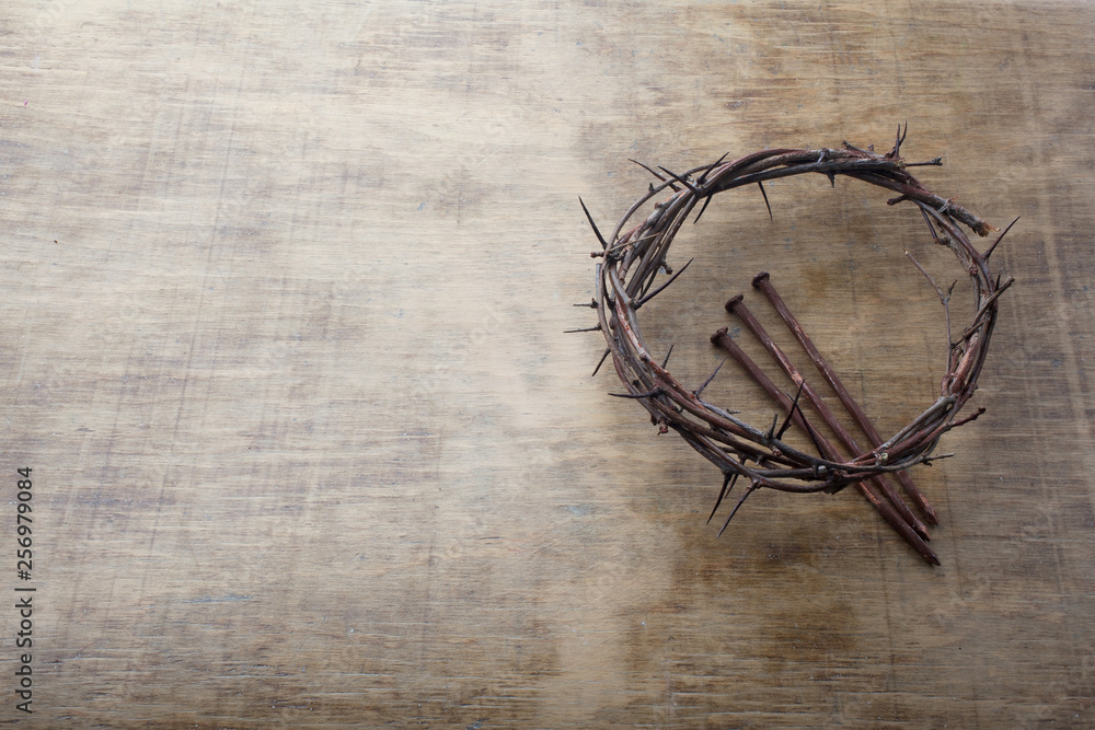 Fototapeta premium Jesus Crown Thorns and nails on Old and Grunge Wood Background. Vintage Retro Style. Free space for text