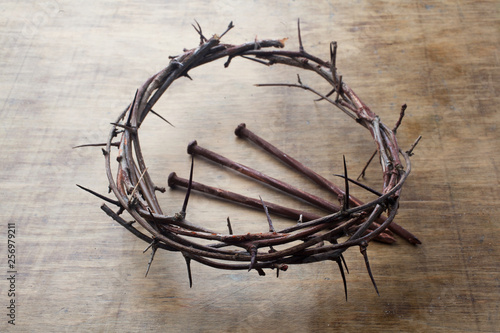 Jesus Crown Thorns and nails on Old and Grunge Wood Background. Vintage Retro Style.