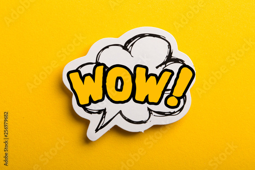 WOW Speech Bubble Isolated On Yellow Background photo