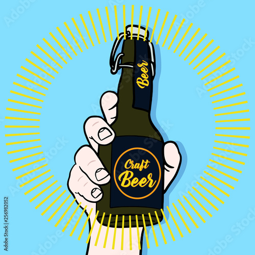Hand drawn vector illustration with a brown green bottle of craft beer. Blue background and golden halo around the beer