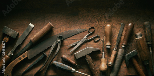 Dark moody arrangement of vintage hand tools