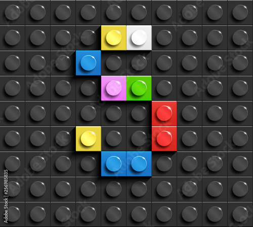 Colorful letters S of alphabet from building bricks on black brick background. 3d letters