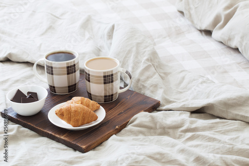 two cups of coffee on tray in bedroom