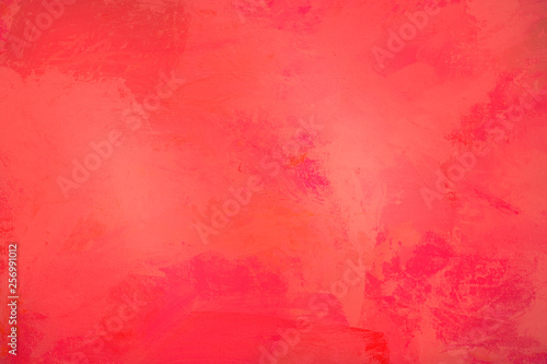 The abstract bright red surface has a brush painted on the background for graphic design.   