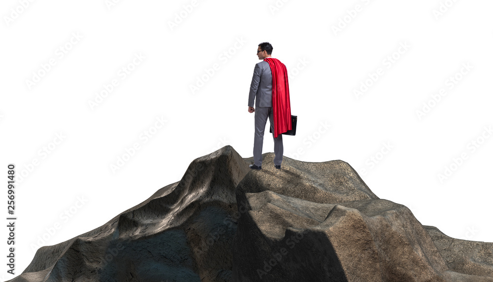 Superhero businessman on top of mountain