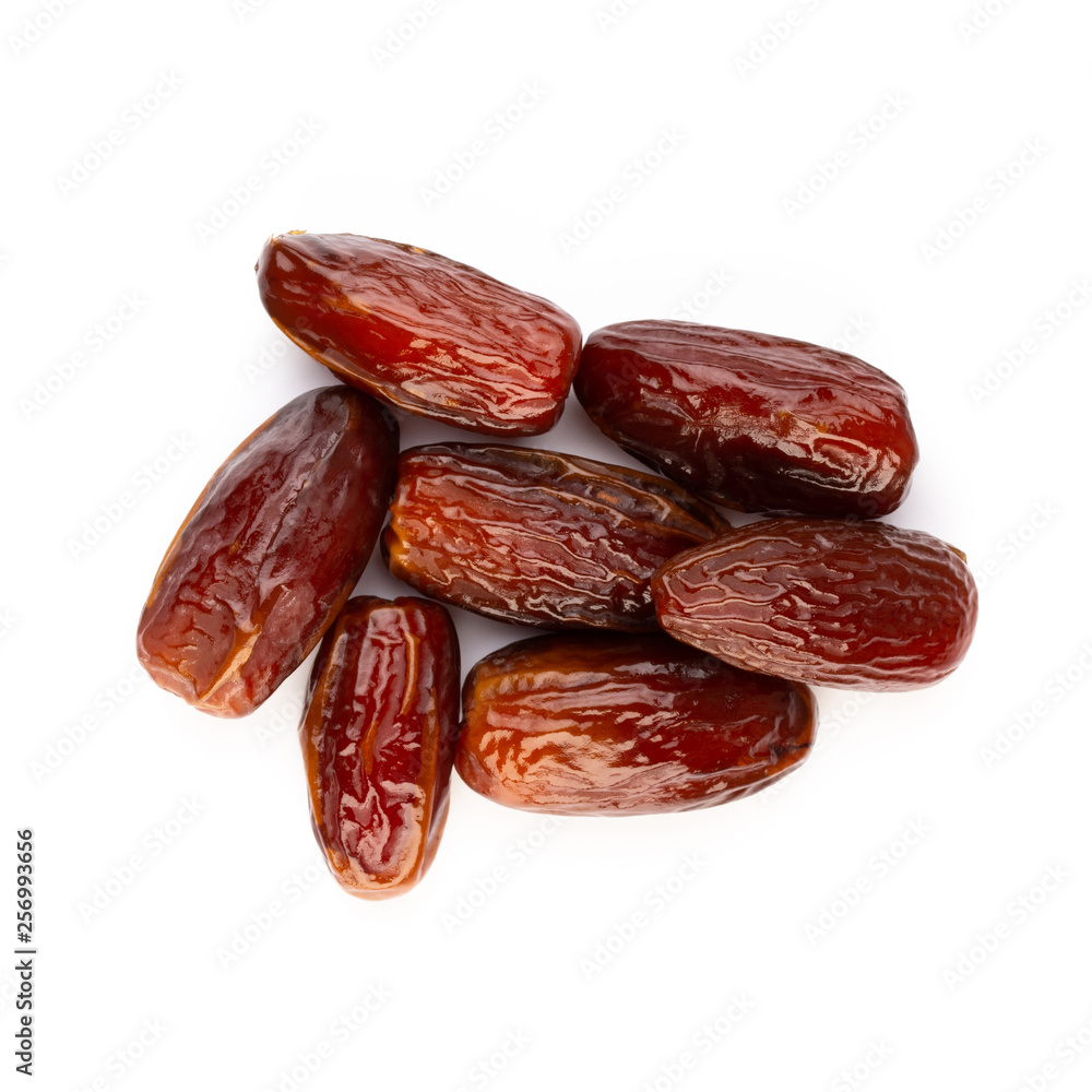 Dry dates isolated on white background. Top view. Flat lay pattern. Dry dates isolated on white background. Top view. Flat lay pattern.