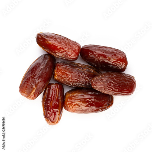 Dry dates isolated on white background. Top view. Flat lay pattern.