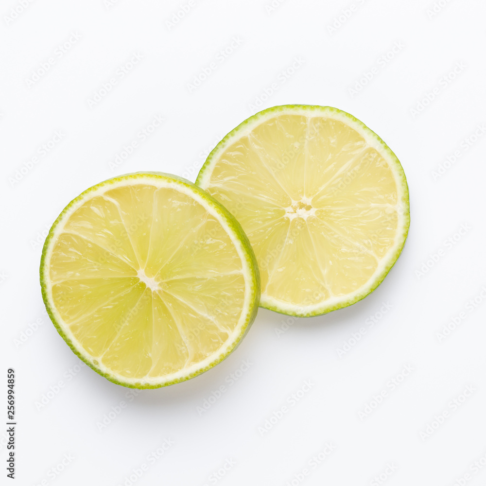 Composition with fresh ripe limes on light background, top view Composition with fresh ripe limes on light background, top view
