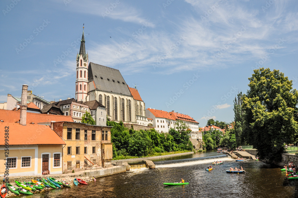 Paddlers on the river in Czech Krumlov (Cesky Krumlov). Stop for boaters floating on the river Vltava in South Bohemia. Paddlers in Cesky Krumlov - UNESCO World Heritage Site.