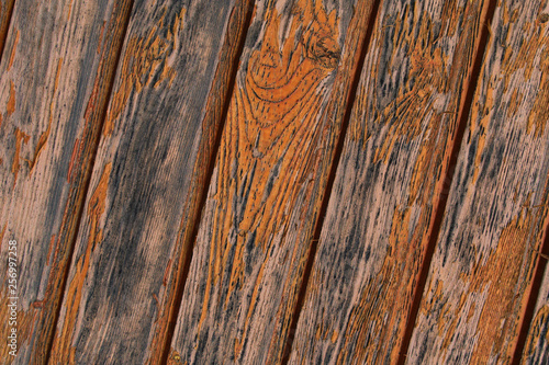 oblique wood panel vertical strip joints weathered rigid base flaky old orange paint grunge background