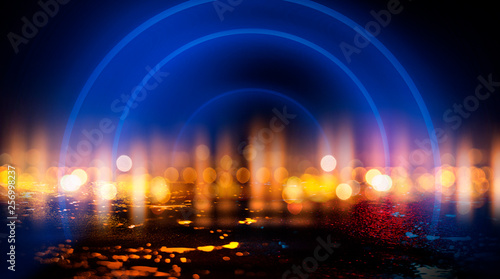 Neon circle  wet asphalt  reflection. Neon circle with the center of a dark empty scene with spotlights. Abstract light. Lights of the night city  abstract light bokeh  smog  smoke.