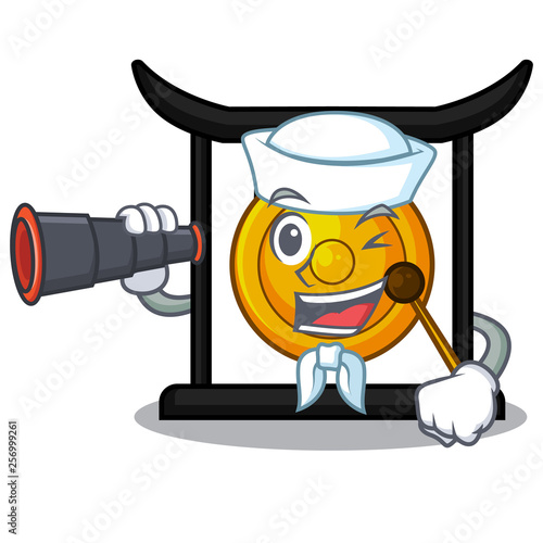 Sailor with binocular golden gong isolated with the mascot