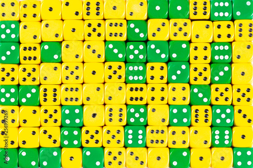 Background of 140 random ordered green and yellow dices