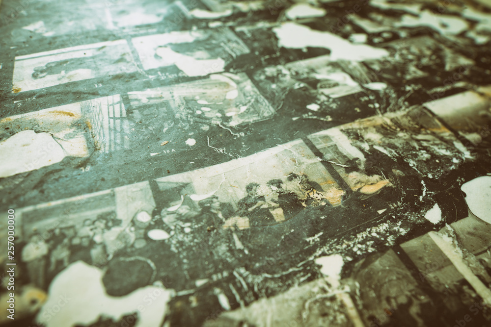 Fototapeta premium Old contact sheet damaged by chemical reaction. All photos are mine and people are unrecognizable. Retro technology souvenir background.