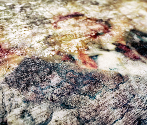 Abstract background made with mix of chemicals on white fabric. Colorful arty texture. photo