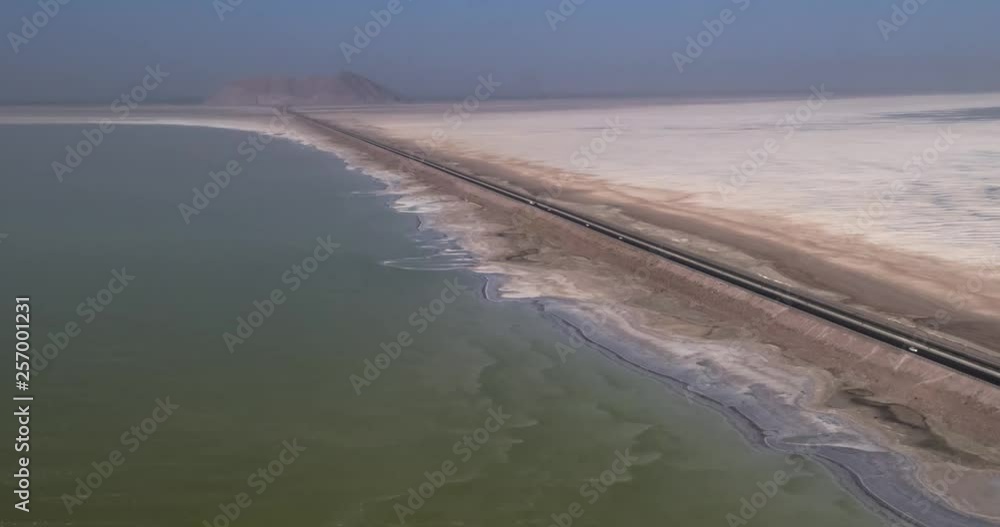 Aerial photography. From a bird's eye view of the road that crosses the salty lake Urmia, Iran. 4k. Aerial photography. From a bird's eye view of the road that crosses the salty lake Urmia, Iran. 4k.