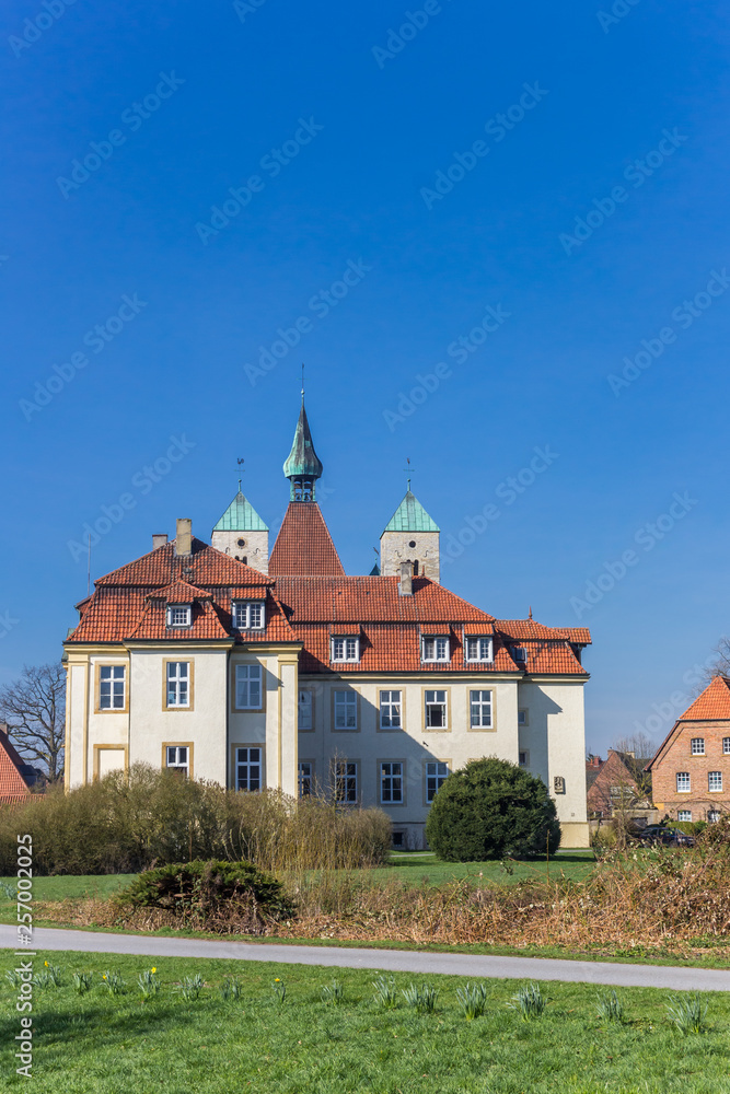 Castle and church towers in historic city Freckenhorst, Germany