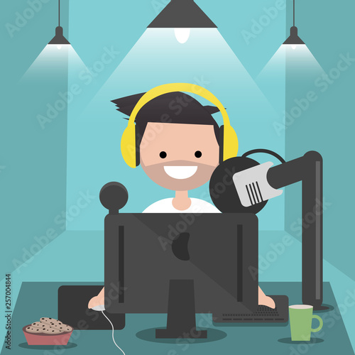 Young character sitting at computer desk.Streaming.Cloud gaming service.Flat cartoon design.Clip art