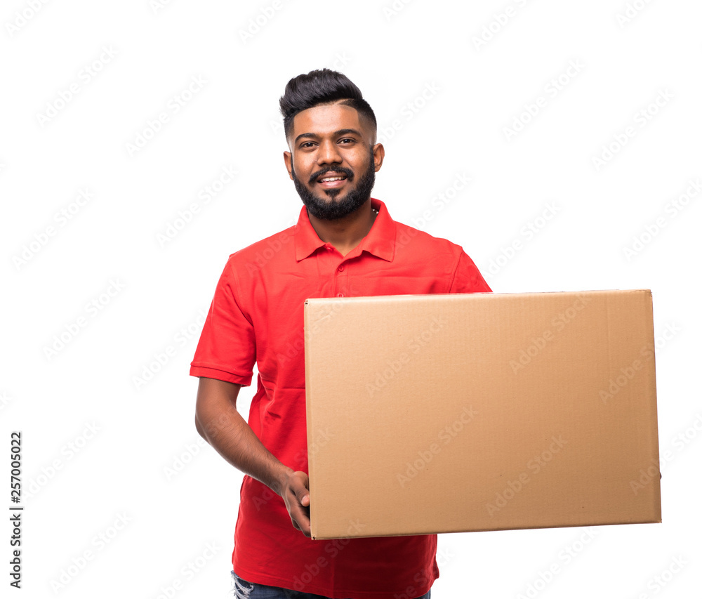 Indian Asian handsome delivery man with Box, isolated over white background Indian Asian handsome delivery man with Box, isolated over white background