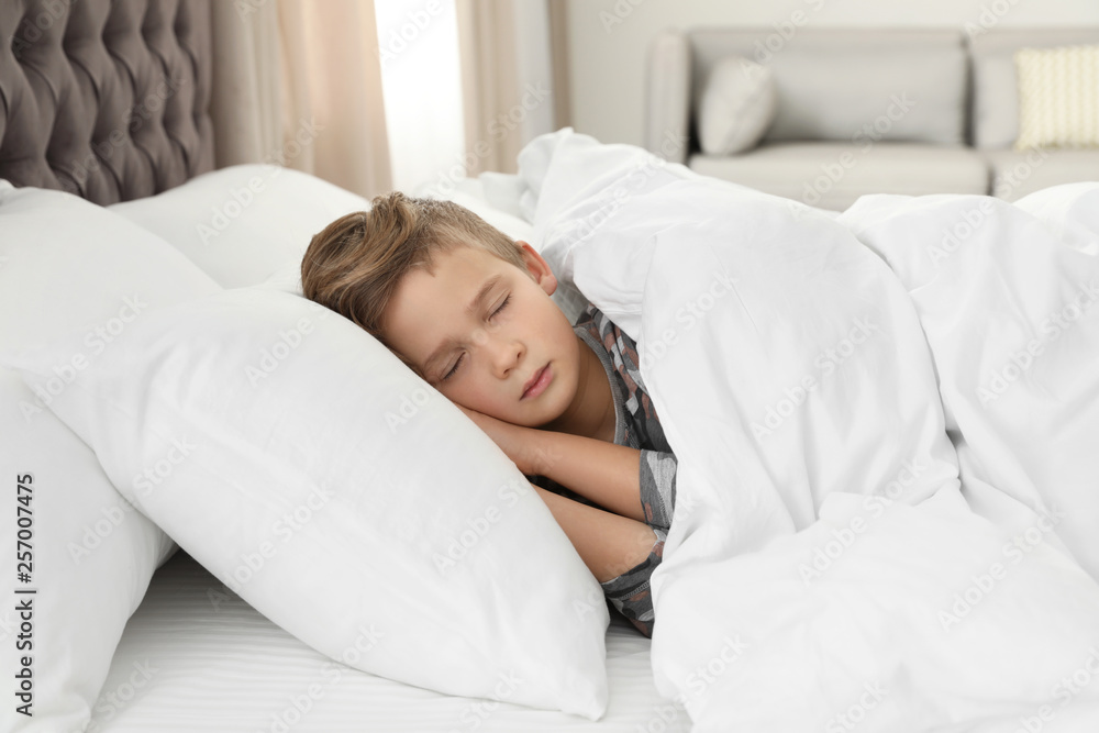Cute tired boy sleeping in comfortable bed Cute tired boy sleeping in comfortable bed