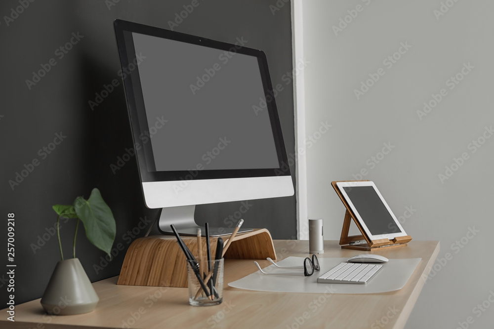 Modern workplace interior with computer on table. Space for text Modern workplace interior with computer on table. Space for text