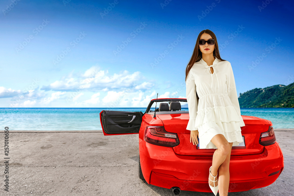 Fototapeta premium Red sport summer car and slim young woman in dress. 