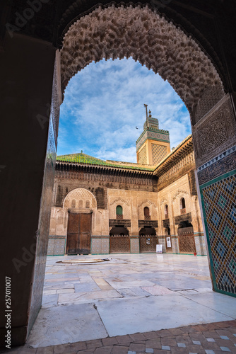 FES, MOROCCO - November 16, 2018: The minaret view and Inside interior of The Madrasa Bou Inania ( Medersa el Bouanania ) is acknowledged as an excellent example of Marinid architecture. Souk Medina o