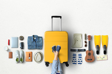 Travel concept with a large suitcase and other accessories