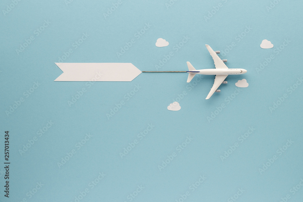 airplane on blue sky background  top view with copy space for your text. flat lay. 