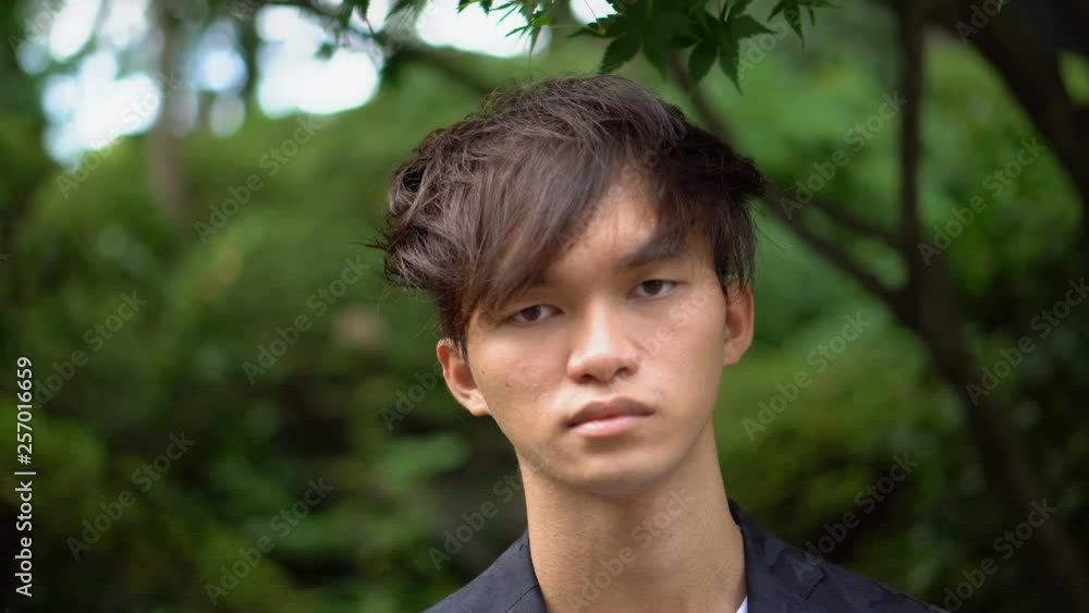 Young Asian Man Portrait With Serious Face Young Asian Man Portrait With Serious Face