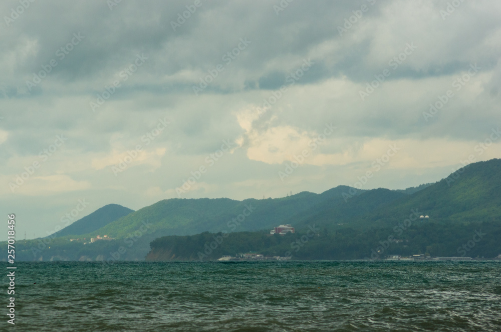 sea landscape is a pebbly beach with waves in white foam sea landscape is a pebbly beach with waves in white foam