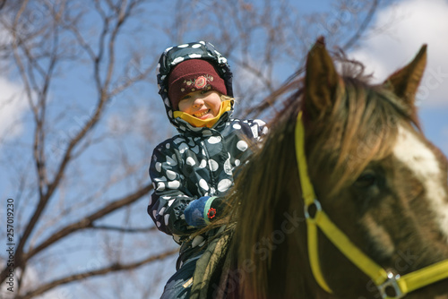 little girl riding a horse