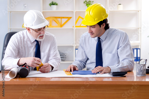 Two engineers colleagues working under project