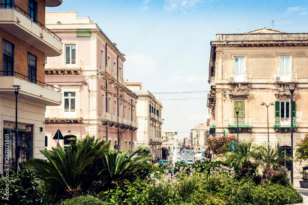 Ancient street with old houses on Ortygia Island, Syracuse (Siracusa), Sicily.