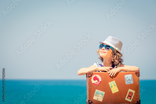 Child enjoys a summer vacation at the sea photo