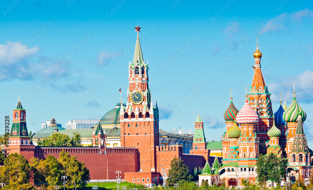 Spasskaya Tower and Cathedral of Vasily the Blessed (Saint Basil's Cathedral) in sunny autumn day. Red Square. Moscow. Russia