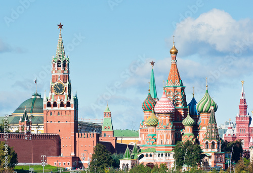 Spasskaya Tower of Moscow Kremlin and Cathedral of Vasily the Blessed (Saint Basil's Cathedral) in sunny day. Red Square. Moscow. Russia