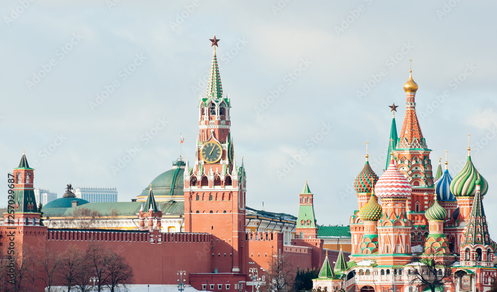 Spasskaya Tower and Cathedral of Vasily the Blessed (Saint Basil's Cathedral) on Red Square. Winter day. Moscow. Russia Spasskaya Tower and Cathedral of Vasily the Blessed (Saint Basil's Cathedral) on Red Square. Winter day. Moscow. Russia