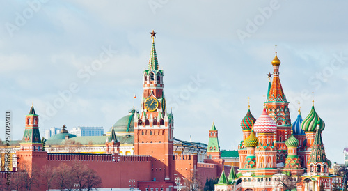 Spasskaya Tower of Moscow Kremlin and the Cathedral of Vasily the Blessed (Saint Basil's Cathedral) on Red Square. Sunny winter day. Moscow. Russi