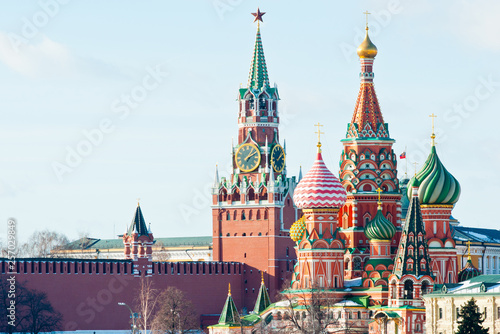 Spasskaya Tower of Moscow Kremlin and the Cathedral of Vasily the Blessed (Saint Basil's Cathedral) on Red Square. Sunny winter day. Moscow. Russia