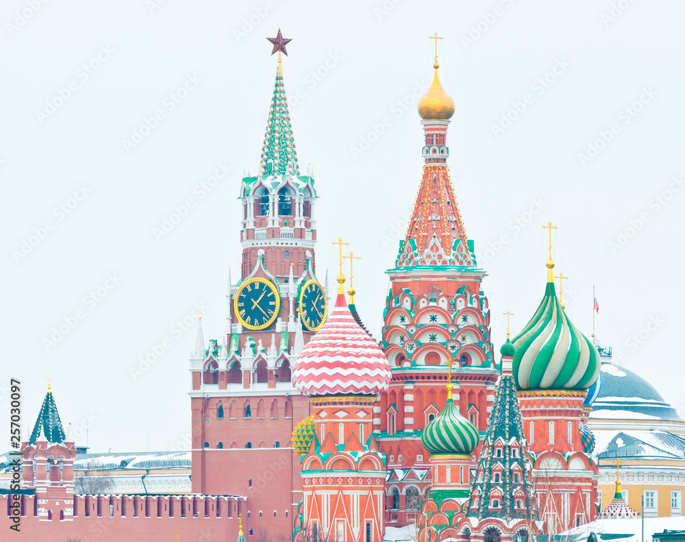 Spasskaya Tower of Moscow Kremlin and the Cathedral of Vasily the Blessed (Saint Basil's Cathedral) on Red Square. Winter day. Moscow. Russia