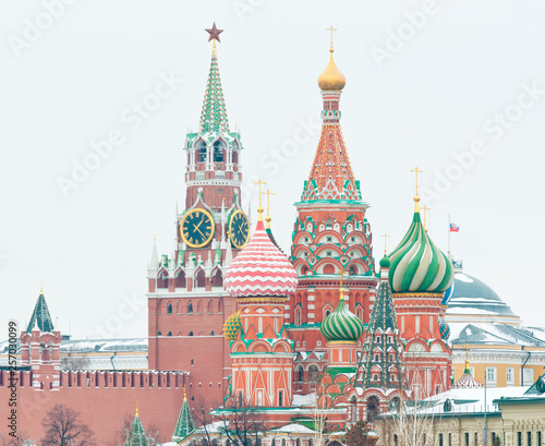 Spasskaya Tower of Moscow Kremlin and the Cathedral of Vasily the Blessed (Saint Basil's Cathedral) on Red Square. Winter day. Moscow. Russia