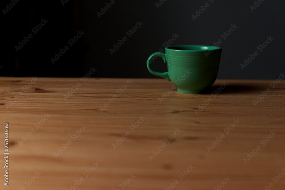 Tea Cup on Table - Dark Background Tea Cup on Table - Dark Background