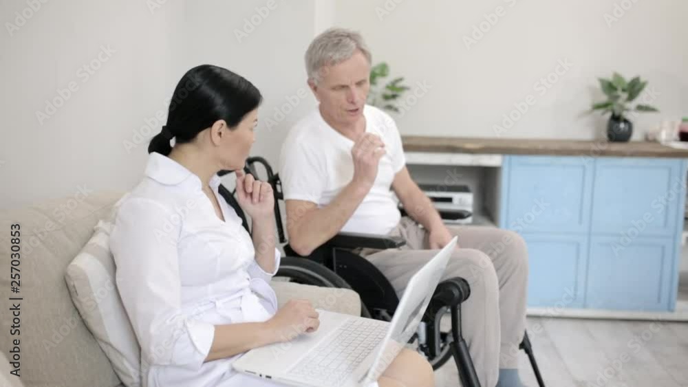 Nurse looking after disabled man Nurse looking after disabled man