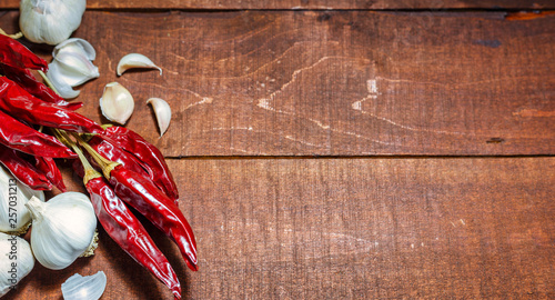 Hot spices on a wooden background